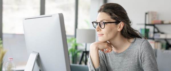 a woman with her hands on her chin