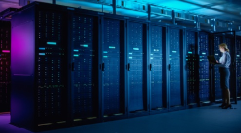 a person standing in a server room